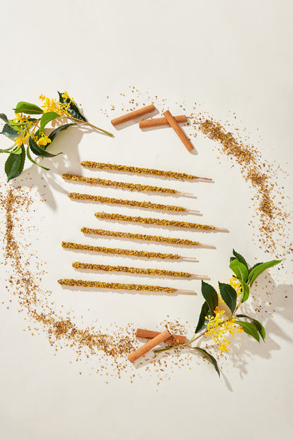 Close-up showing the rich texture of the artisan, all-natural cinnamon and osmanthus petal incense stick.